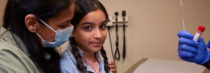 Mother with daughter getting tested