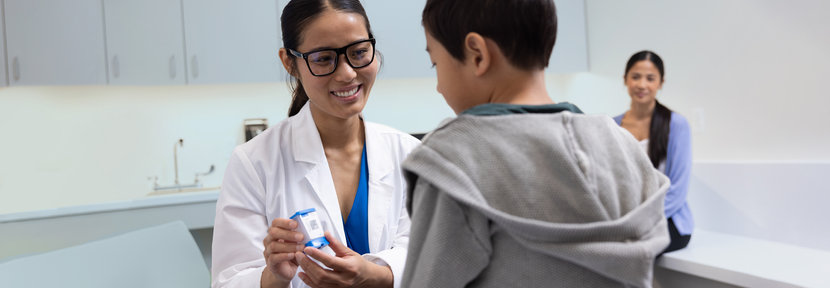 Doctor and patient looking at cartridge